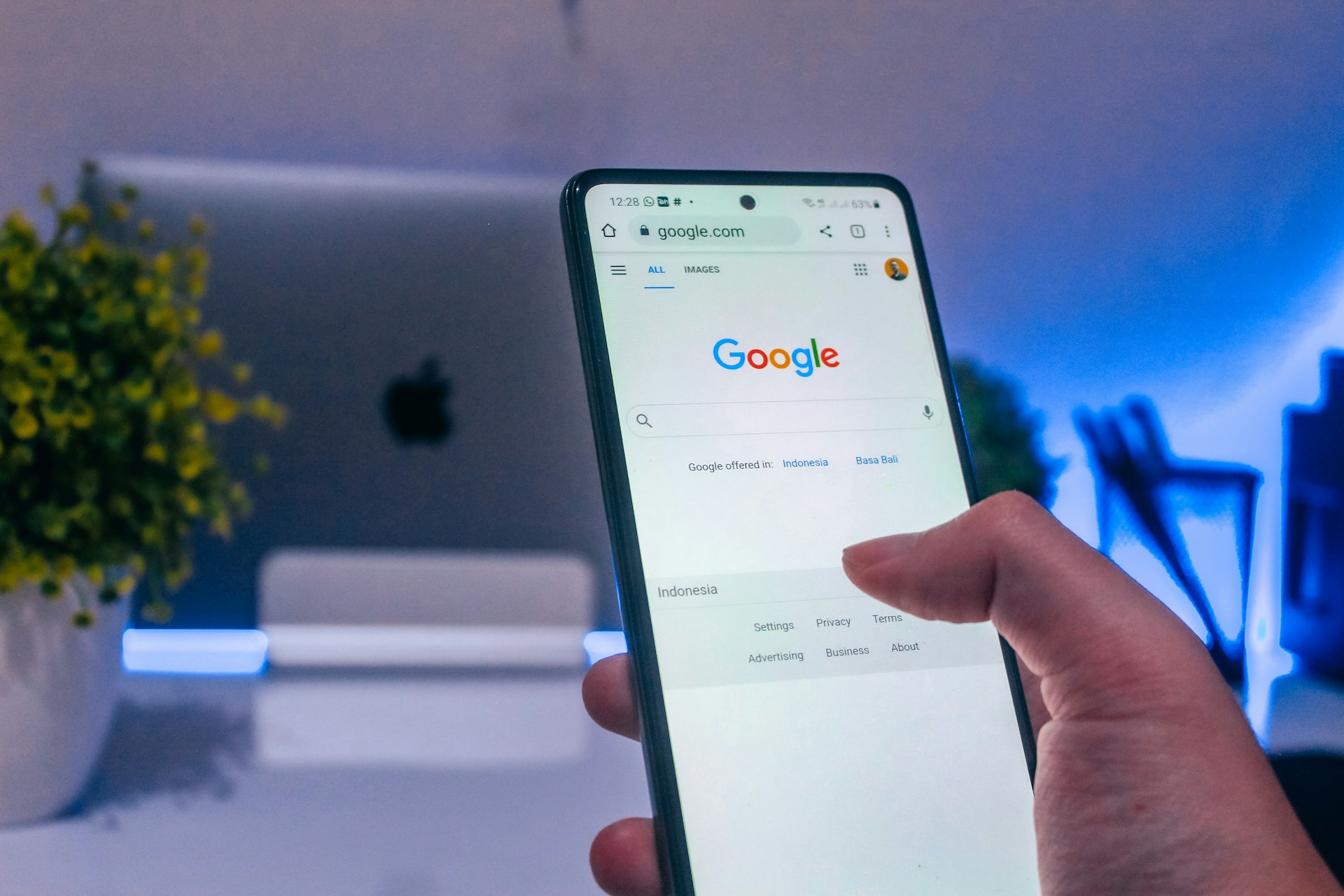 a person holding a phone in Google